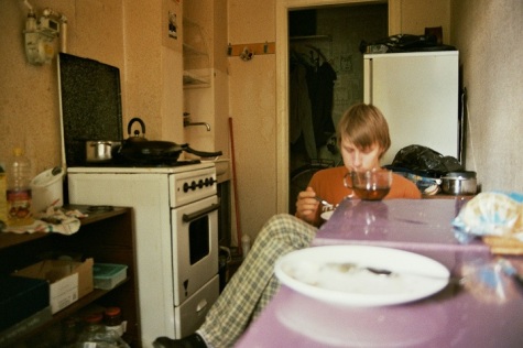 boy sitting home kitchen food eating getting ready breakfast fujicolour superia 200 film 35mm plates mood 